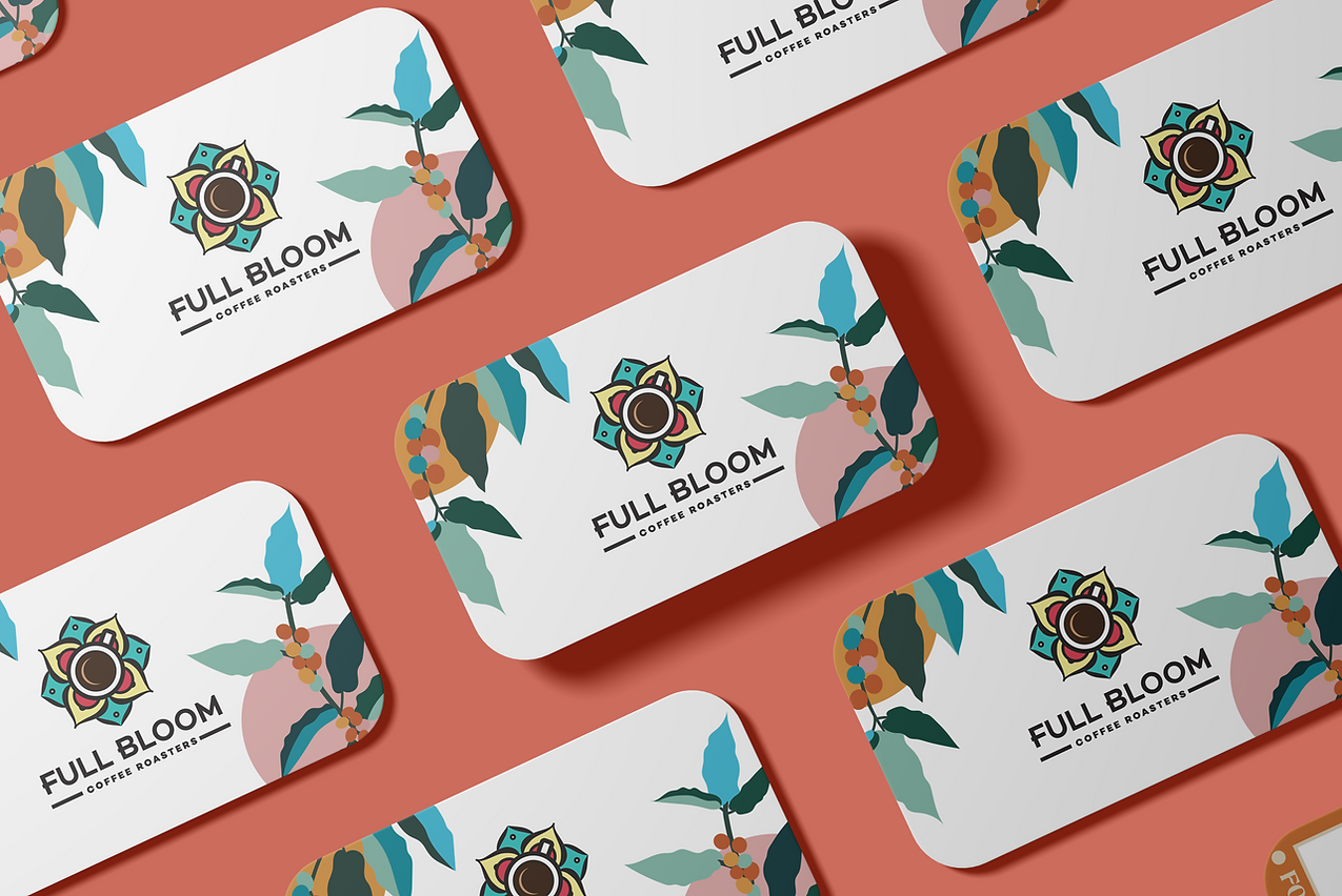 Full Bloom rewards cards with the coffee-flower logo and colourful botanical artwork